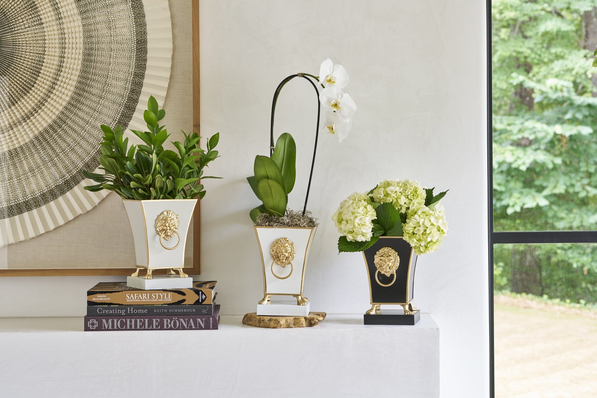 Jaye's Studio lion-head cachepots styled on a sunlit console — brand story